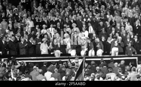 England versus West Germany 1966 World Cup Final, Wembley Stadium Queen Elizabeth hands the Jules Rimet Trophy - The World Cup - to England Caprain Bobby Moore      Photo by Tony Henshaw Archive Stock Photo