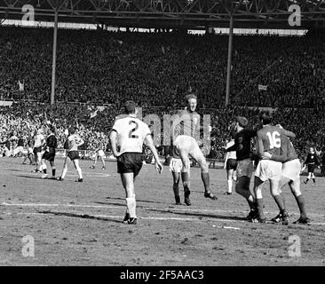 England versus West Germany 1966 World Cup Final, Wembley Stadium England's Jack Charlton jumps in celebration of Martin Peters (16) 18th minute goal.  Photo by Tony Henshaw Archive Stock Photo