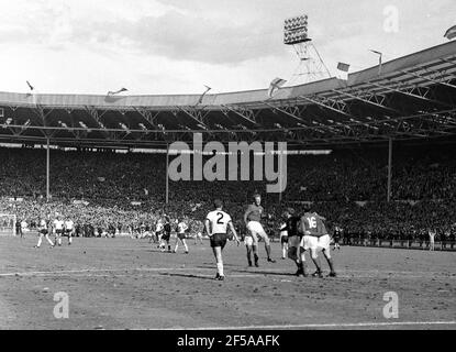 England versus West Germany 1966 World Cup Final, Wembley Stadium England's Jack Charlton jumps in celebration of Martin Peters (16) 18th minute goal.  Photo by Tony Henshaw Archive Stock Photo