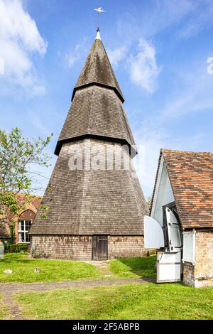 St Augustines church in the Romney Marsh village of Brookland, Kent UK - 13th century octagonal timber bell tower is detached due to marshy ground. Stock Photo