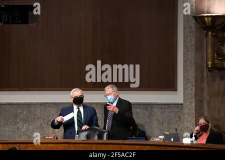 United States Senator Jack Reed (Democrat of Rhode Island), Chairman, US Senate Committee on Armed Services, and US Senator James Inhofe (Republican of Oklahoma), Ranking Member, US Senate Committee on Armed Services, speak to one another before a hearing on the “United States Special Operations Command and United States Cyber Command” with the Senate Armed Services Committee on Capitol Hill in Washington DC on March 25th, 2021.Credit: Anna Moneymaker/Pool via CNP /MediaPunch Stock Photo