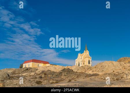 Beautiful panoramic view of the protestant german colonial church Felsenkirche in Luederitz, Luderitz in Namibia, Africa. Stock Photo