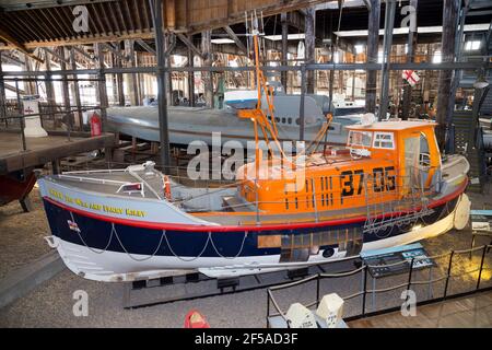 Old vintage historic RNLB Lifeboat 'The Will and Fanny Kirby' on display at Number Four Boat House / Boathouse Number 4 at Historic Dockyard / Dockyards Chatham in Kent. UK (121) Stock Photo