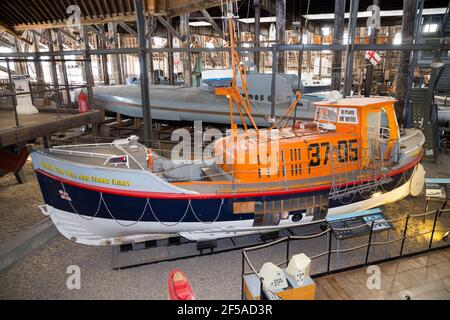 Old vintage historic RNLB Lifeboat 'The Will and Fanny Kirby' on display at Number Four Boat House / Boathouse Number 4 at Historic Dockyard / Dockyards Chatham in Kent. UK (121) Stock Photo