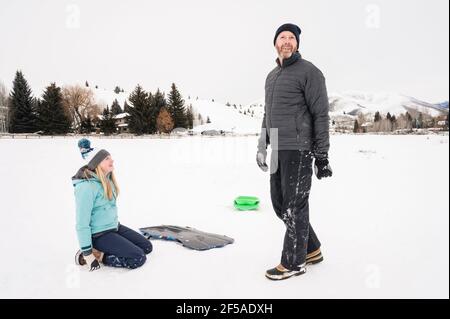 Father and Daughter Smiling and Talking on Snowy Day in Ketchum, ID Stock Photo