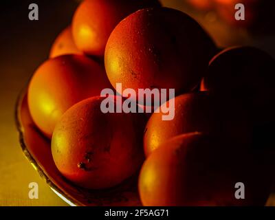 The chicken eggs in the panel are placed on a brown wooden background. Stock Photo