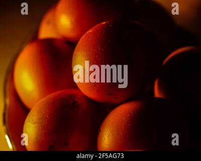 The chicken eggs in the panel are placed on a brown wooden background. Stock Photo