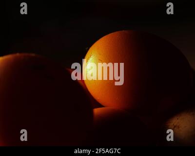 The chicken eggs in the panel are placed on a brown wooden background. Stock Photo
