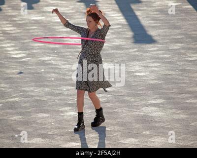 Hula hooping on the seafront at Brighton Stock Photo