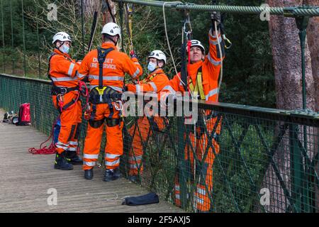 Dorset Fire Service carrying out training exercise on suspension bridge at Alum Chine, Bournemouth, Dorset UK in March during Covid-19 lockdown Stock Photo