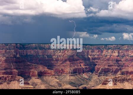 Lightning strike from a monsoon thunderstorm over the Grand Canyon in Arizona Stock Photo