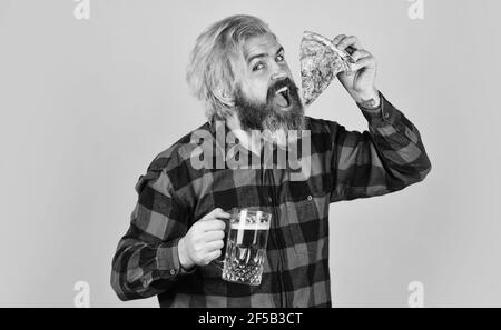 bachelor men club. Having fun and drink in bar. nice pub menu. man watching football while drinking beer and eating pizza. eating pizza and drinking Stock Photo