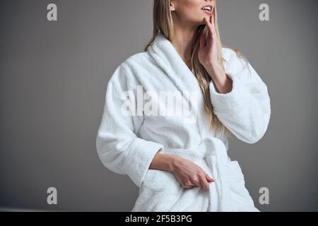 Slim spa client standing in a beauty salon Stock Photo