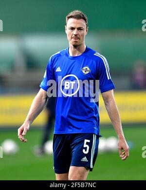 Northern Ireland's Jonny Evans warms up on the pitch ahead of the FIFA 2022 World Cup qualifying group C match at Stadio Ennio Tardini, Parma. Picture date: Thursday March 25, 2021. Stock Photo