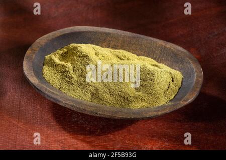 Organic green powder in the wooden bowl Stock Photo
