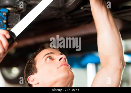 Woman does outdoor stretching with her personal trainer on a great summer day Stock Photo