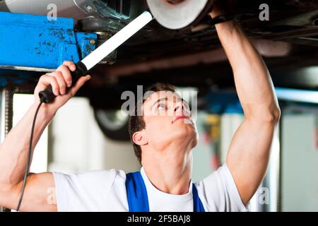 Woman does outdoor stretching with her personal trainer on a great summer day Stock Photo