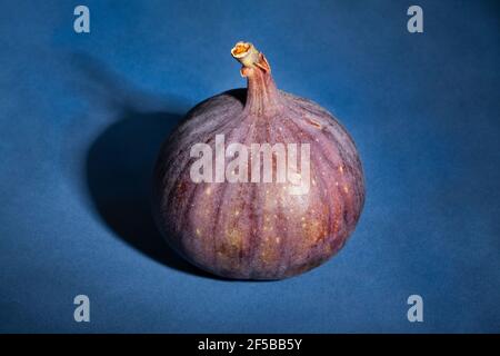 figs fruit on blue background Stock Photo