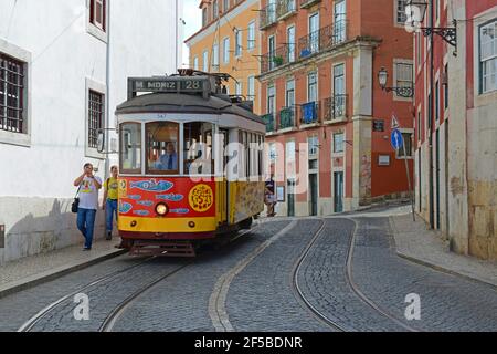 Antique Tram Route 28 at Largo Portas Sol station in Alfama district in city of Lisbon, Portugal. Stock Photo