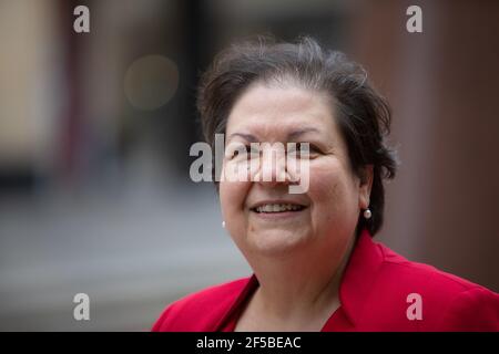 Glasgow, UK. 25th Mar, 2021. Jackie Baillie, Deputy Leader of Scottish Labour Party, promotes her party's election message C a National Recovery Plan, beside the statue of former Scottish Labour leader and First Minister, Donald Dewar, in Glasgow. Photo Credit: jeremy sutton-hibbert/Alamy Live News Stock Photo