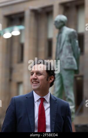 Glasgow, UK. 25th Mar, 2021. Anas Sarwar, Leader of Scottish Labour Party, promotes his party's election message C a National Recovery Plan, beside the statue of former Scottish Labour leader and First Minister, Donald Dewar, in Glasgow. Photo Credit: jeremy sutton-hibbert/Alamy Live News Stock Photo