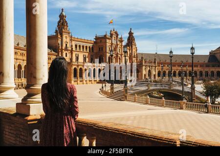 Woman tourist back in Spain Square of Seville, Andalusia Stock Photo