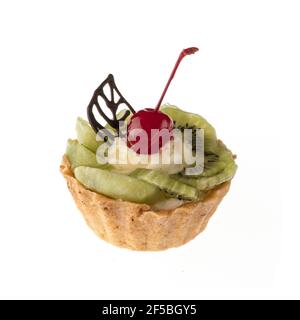 Dessert, cake with kiwi and cherries on a white plate isolated Stock Photo