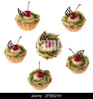 Dessert, cake with kiwi and cherries on a white plate isolated Stock Photo