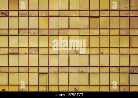 Yellow sunlit building glass facade windows Stock Photo