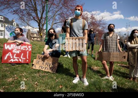 Protesters hold placards during the “Keep the Promise” rally in Dunn Meadow to advocate for Indiana University to reach carbon neutrality by 2040.Students for a New Green World, a student organization which works to combat climate change, and IU Student Government's environmental affairs committee organized the protest to advocate for climate change action at IU which took place in Dunn Meadow. The demonstration was organized in support of an IUSG resolution created by the environmental affairs committee which unanimously passed in IUSG congress on March 8. (Photo by Jeremy Hogan/SOPA Images Stock Photo