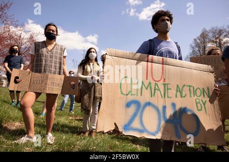 Protesters hold placards during the “Keep the Promise” rally in Dunn Meadow to advocate for Indiana University to reach carbon neutrality by 2040.Students for a New Green World, a student organization which works to combat climate change, and IU Student Government's environmental affairs committee organized the protest to advocate for climate change action at IU which took place in Dunn Meadow. The demonstration was organized in support of an IUSG resolution created by the environmental affairs committee which unanimously passed in IUSG congress on March 8. (Photo by Jeremy Hogan/SOPA Images Stock Photo