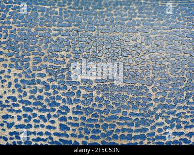 Old leather texture. Blue cracked skin. Dotted blue texture on the fabric. Stock Photo