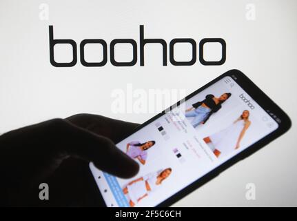 In this photo illustration the Boohoo website of a British online fashion retailer is seen on a mobile phone with the Boohoo logo in the background Stock Photo Alamy