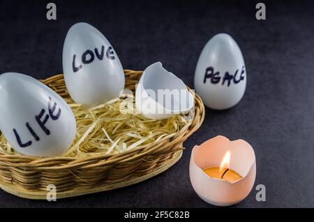 Easter, the time of Christ's resurrection, celebration of life, Easter eggs with candlelight. Stock Photo