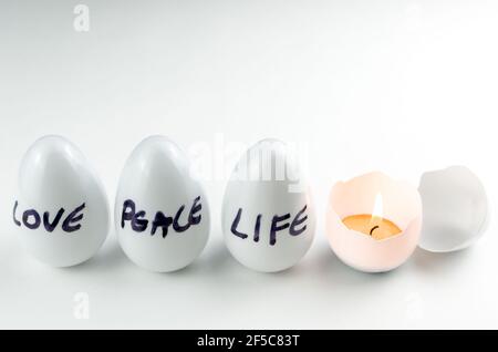 Easter, the time of Christ's resurrection, celebration of life, Easter eggs with candlelight. Stock Photo