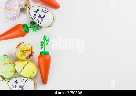 Colorful Easter eggs and other objects on a trendy white background for various Easter themed backgrounds Stock Photo