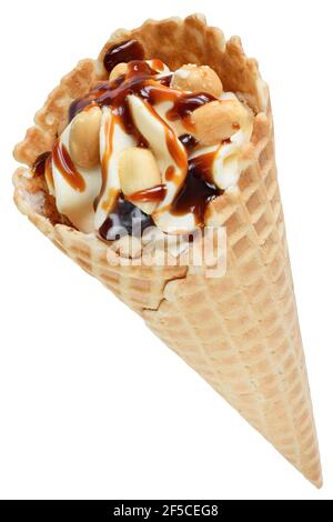 Ice cream in a waffle cone with peanuts and caramel isolated on a white background. Stock Photo