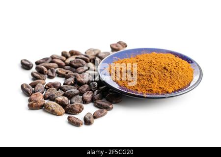 Roasted cocoa beans and cocoa powder isolated on white background. Stock Photo
