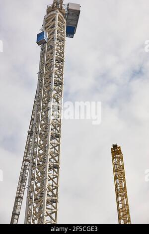 Telescopic cranes under a white sky. Construction engineering industry Stock Photo