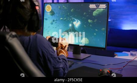 Professional pro gamer playing space shooter video game new graphics on  powerful computer from home. Virtual shooter game in cyberspace, esports  player performing on pc gaming tournament Stock Photo - Alamy