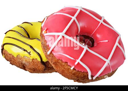 Donuts in strawberry, banana glaze and multicolored confectionery sprinkles isolated on white background. Stock Photo