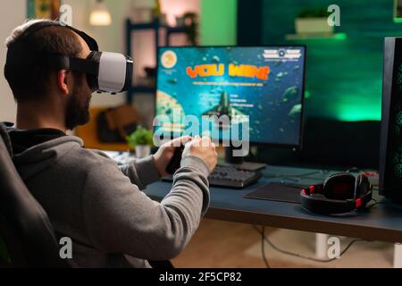 Pro woman egame cyber playing online with virtual reality headset and  wireless controller. Virtual space shooter championship in cyberspace,  esports player performing on pc during gaming tournament Stock Photo - Alamy