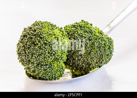 Close-up of two edible broccoli flower heads, London, UK Stock Photo