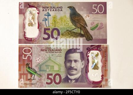 (210326) -- WELLINGTON, March 26, 2021 (Xinhua) -- Photo taken on March 26, 2021 shows a New Zealand's 50 note featuring kokako pattern.  Recovery efforts over more than two decades have seen the North Island kokako, one of New Zealand's most iconic birds, brought back from the brink of extinction, New Zealand's Conservation Minister Kiri Allan said Friday.   The kokako makes up two species of endangered forest birds which are endemic to New Zealand, the North Island kokako and the presumably extinct South Island kokako. (Xinhua/Lu Huaiqian)