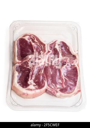 Raw lamb  chops in vacuum package isolated on white Stock Photo