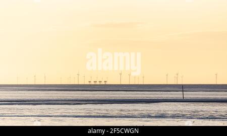 Red Sands Fort and Wind Turbines Forming Part of London Array Wind Farm at Mouth of Thames Estuary at Daybreak on a March Morning Stock Photo