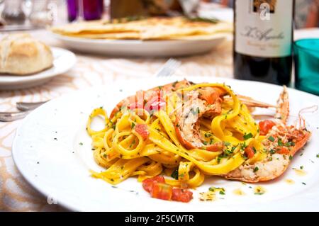 Noodles tagliatelle with shrimp, courgette flower and pesto sauce,  Cagliari, Sardinia, Italy, Europe Stock Photo