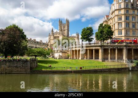 Bath, UK - August 26, 2016: Parade Gardens, the Empire Building and Bath Abbey by the River Avon on a summer day Stock Photo