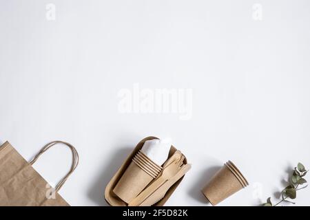 Disposable eco friendly tableware isolated top view. The concept of saving the planet, the rejection of plastic. Stock Photo