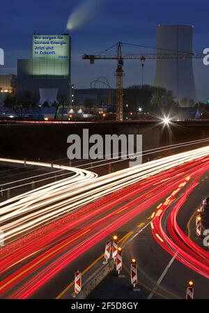 light trails in the evening on the A 43 freeway with the Steag power plant in Herne in the background, Germany, North Rhine-Westphalia, Ruhr Area, Stock Photo